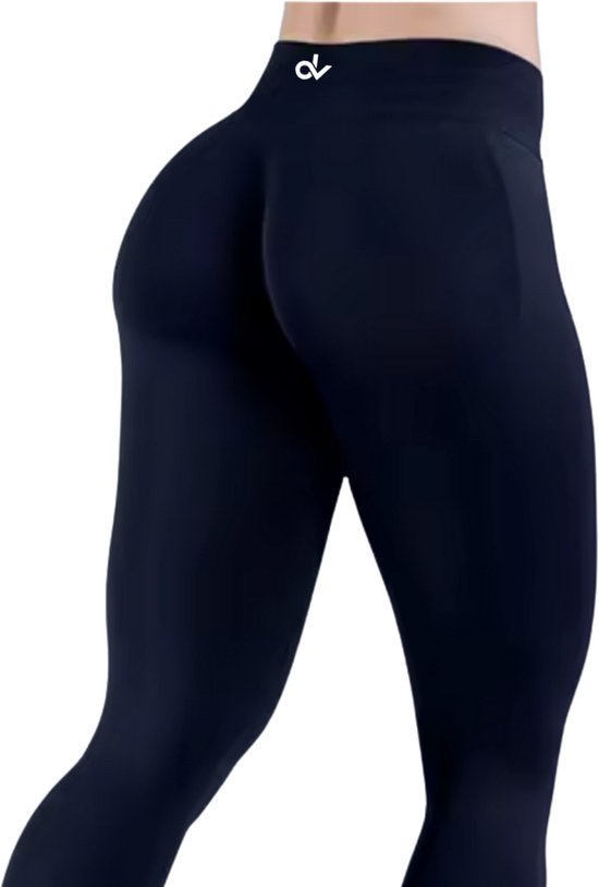 Maat: L - Kleur: Zwart -June Spring DV Anti-Cellulite Legging - High Waist & Butt Lifting. Luxe, naadloos en elegant. Stimuleert de bloedcirculatie en creëert strakke benen. Zonder zak, perfect voor de sportschool én chic te dragen onder een colbert.